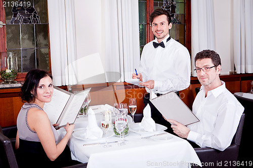 Image of man and woman in restaurant for dinner