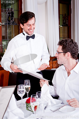 Image of man and woman in restaurant for dinner