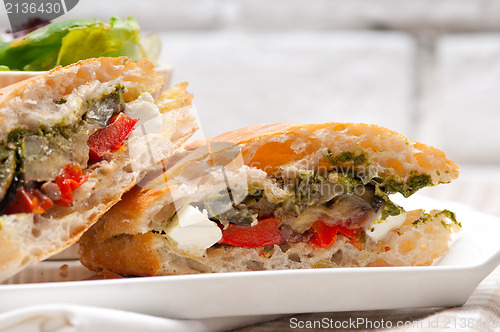 Image of ciabatta panini sandwichwith vegetable and feta