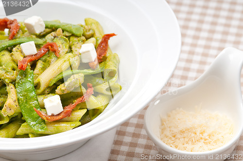 Image of Italian penne pasta with sundried tomato and basil
