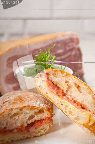 Image of ciabatta panini sandwich with parma ham and tomato