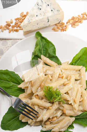 Image of Italian pasta penne gorgonzola and pine nuts