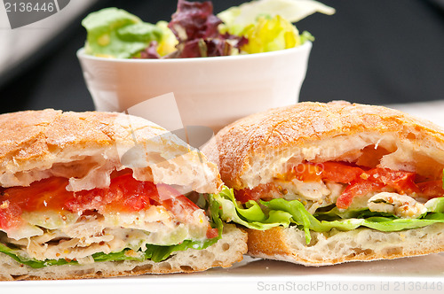 Image of ciabatta panini sandwich with chicken and tomato