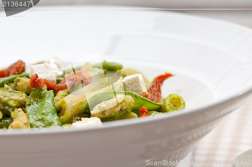 Image of Italian penne pasta with sundried tomato and basil
