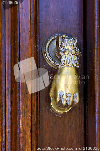 Image of knocker in a closed  door in uruguay