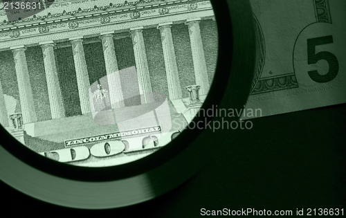 Image of dollar and magnifier