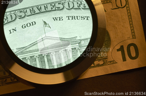 Image of dollar and magnifier