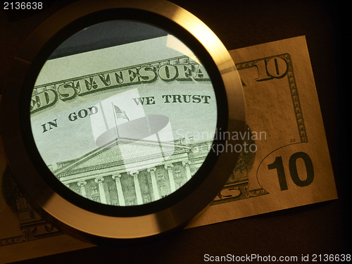 Image of dollar and magnifier