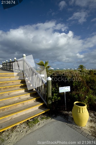 Image of boardwalk with yellow urn