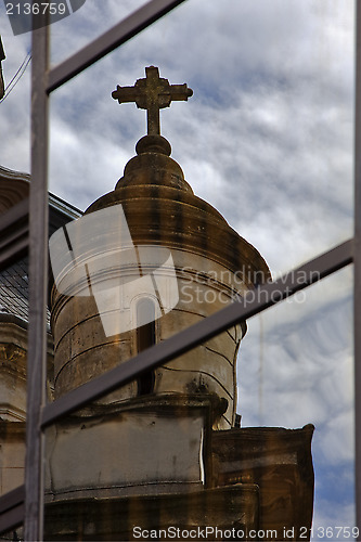 Image of reflex of a church in a window