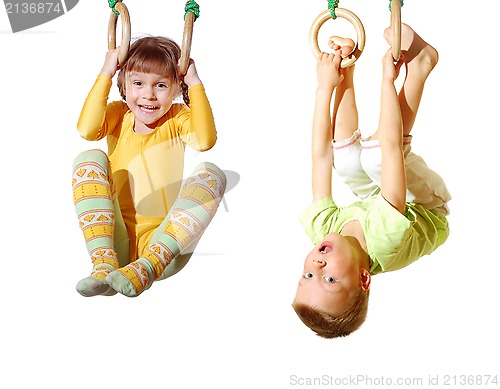 Image of children playing and exercising on gymnastic rings