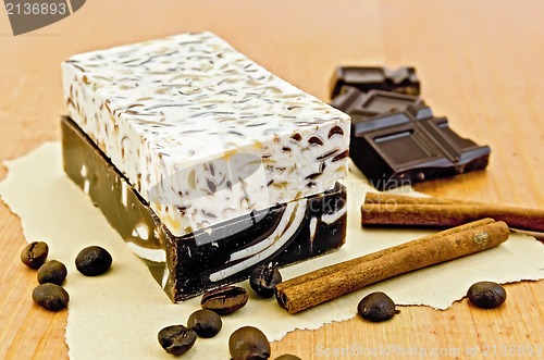 Image of Soap homemade with chocolate and cinnamon on the board