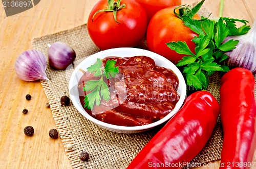 Image of Ketchup with vegetables on a napkin burlap