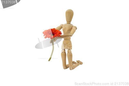 Image of Wooden female doll in action