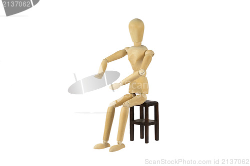 Image of Wooden female doll in action