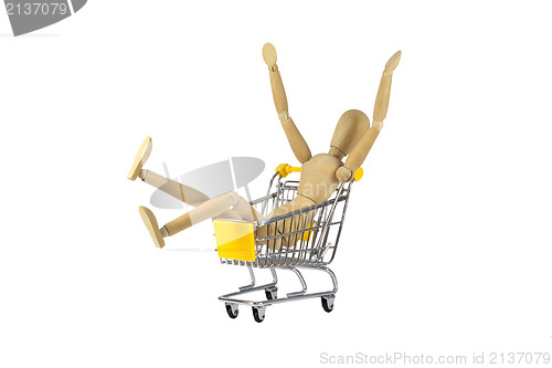 Image of Wooden female doll in shopping madness