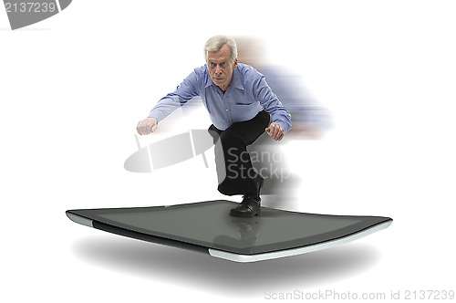 Image of Senior businessman surfing on a PC tablet