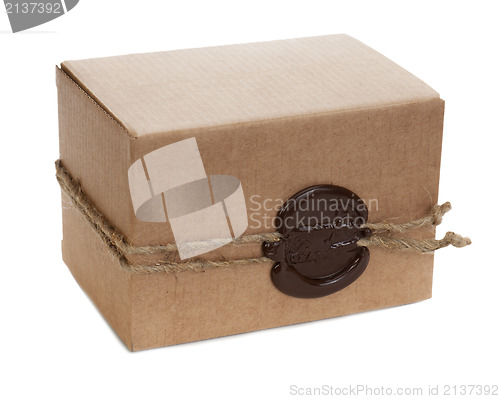 Image of brown cardboard box with stamp isolated on white background 