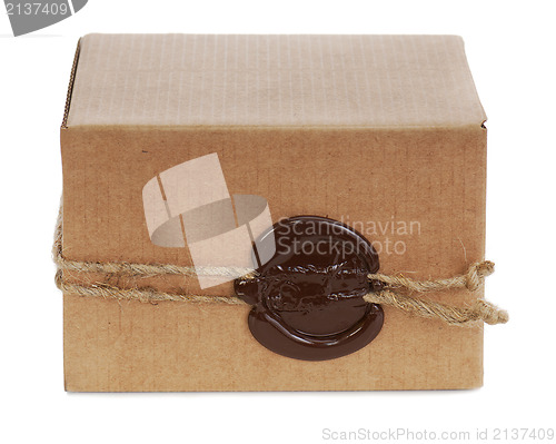 Image of brown cardboard box with stamp isolated on white background