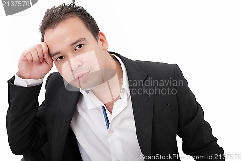 Image of Picture of a pensive young businessman, isolated on white backgr