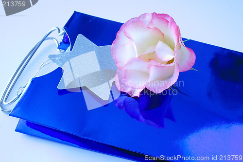 Image of rose on a blue gift bag