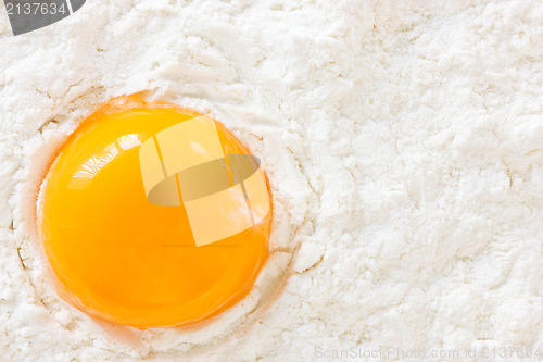Image of yolk in the  flour