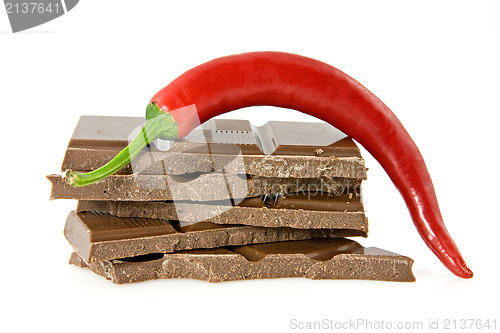 Image of chili pepper on stack of dark chocolate