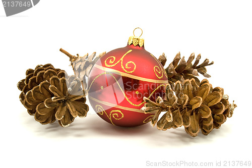 Image of red christmas bauble and pine cones