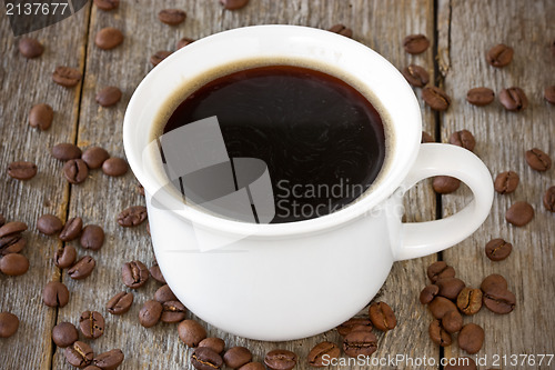 Image of cup of coffee on wood background