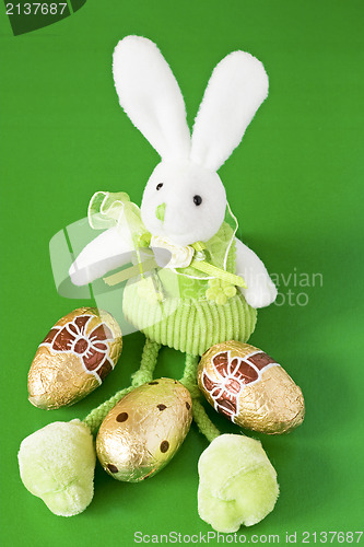 Image of easter bunny and three golden eggs