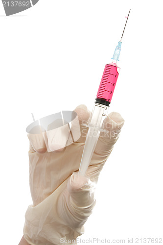 Image of Hand holding syringe