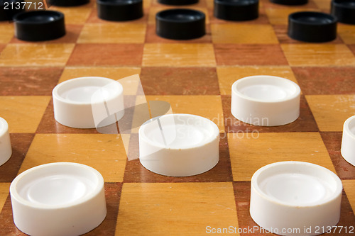 Image of checker board with plastic checkers