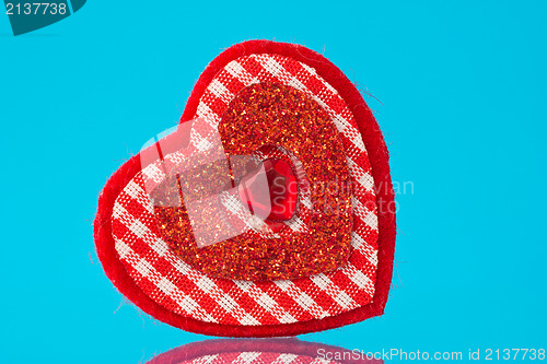 Image of red  heart on blue background