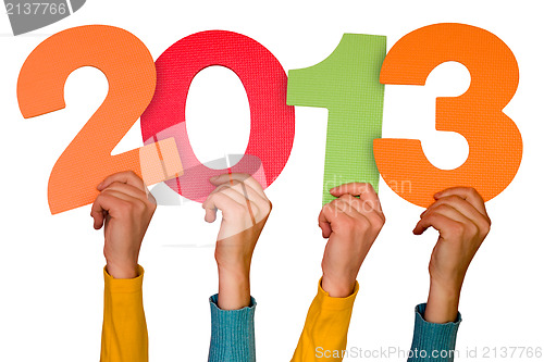 Image of hands with numbers shows year 2013