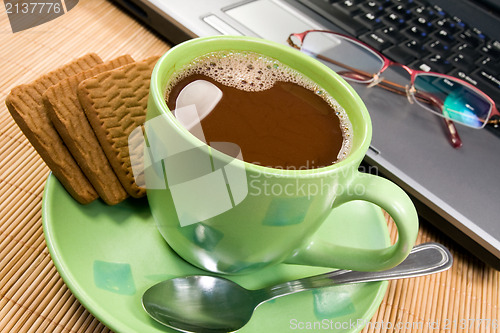 Image of hot drink and computer