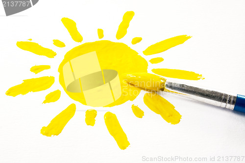 Image of paintbrush and painted sun