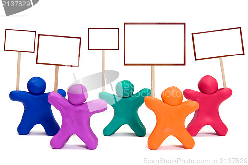 Image of plasticine people with blank posters 