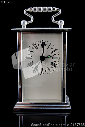 Image of old clock on black background 