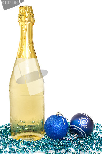 Image of Bottle of champagne and christmas baubles