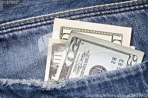 Image of money in a blue jeans pocket
