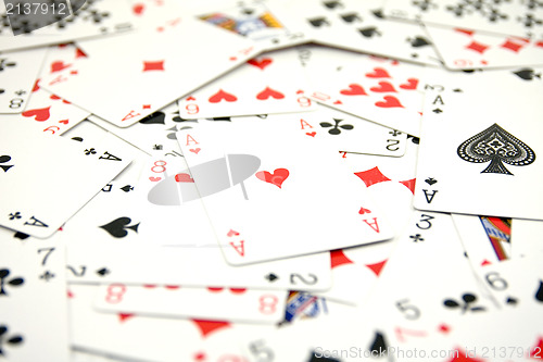 Image of ace of hearts in a middle of cards