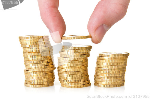 Image of Hand putting golden coins