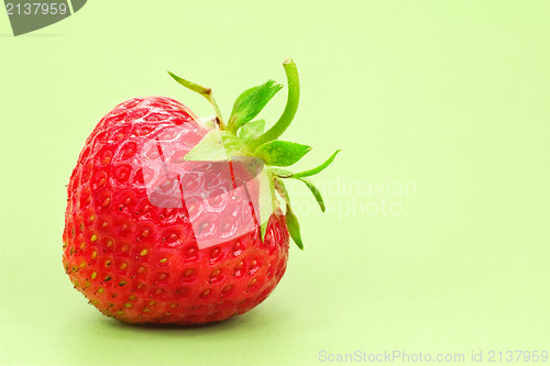 Image of strawberry over a green background