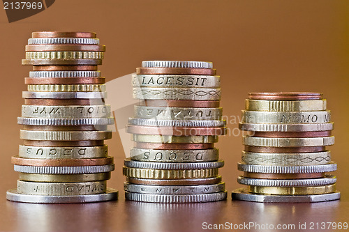 Image of three coins heaps