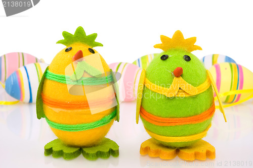 Image of decorative easter chicks and colorful eggs
