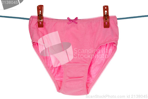 Image of Pink panties hang on the clothes line