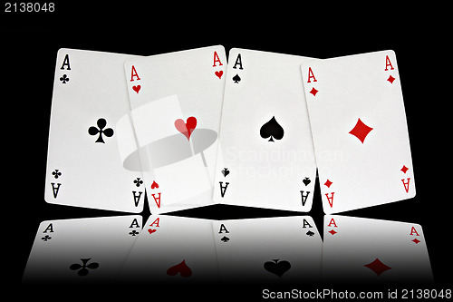 Image of four aces playing cards suits