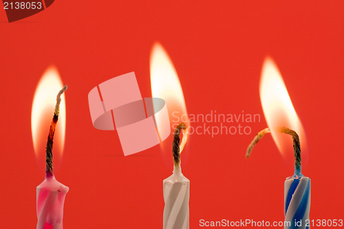 Image of birthday candles on a red background