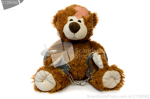 Image of injured and handcuffed Teddy bear