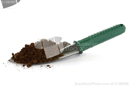 Image of garden spade with soil 